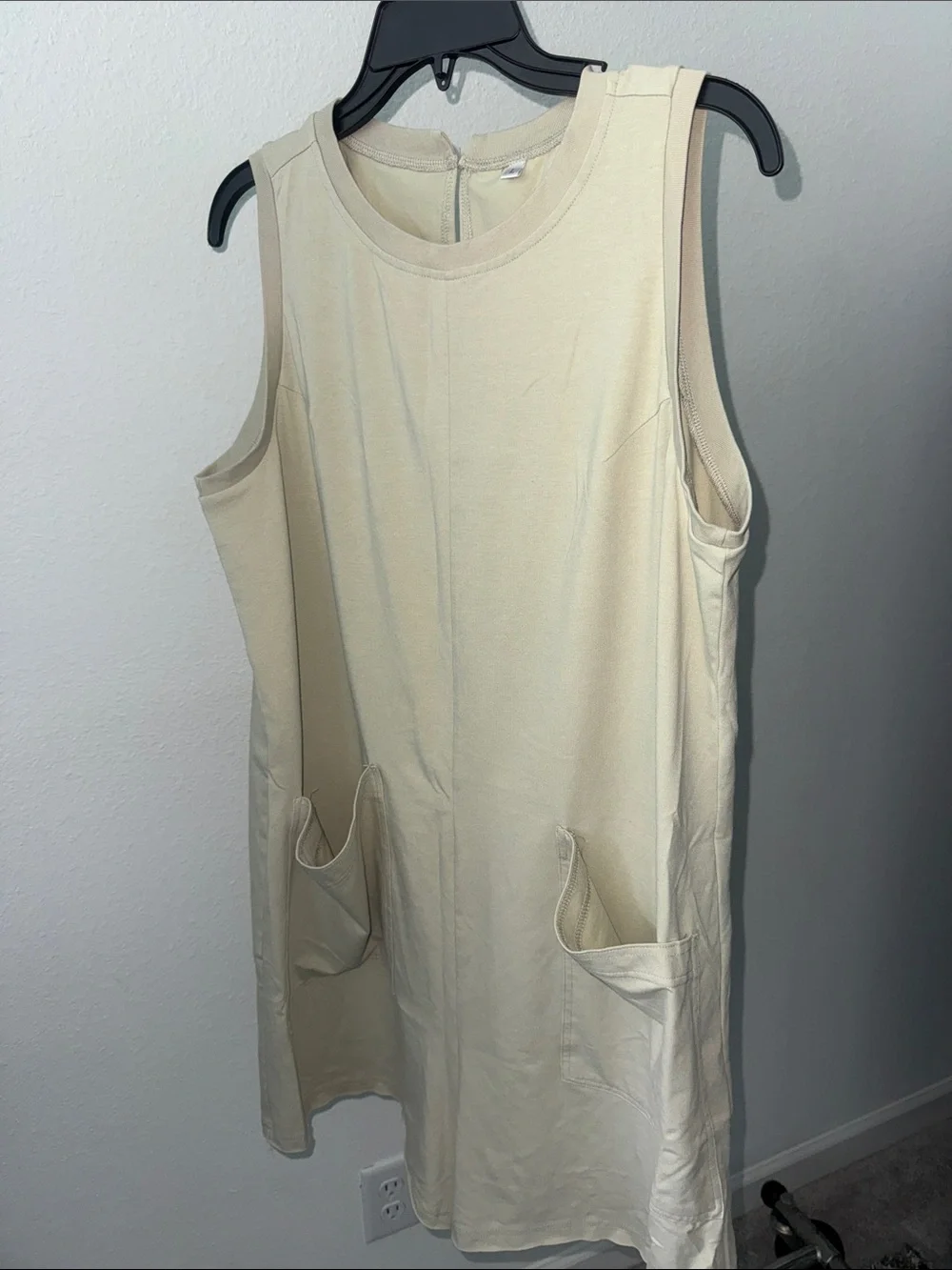 Cream Sleeveless romper with Front Pockets - Picture 1 of 3